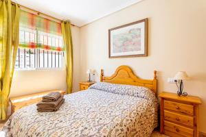 a bedroom with a bed and a window at Lopimar Aurora in Canet de Berenguer +16 photos