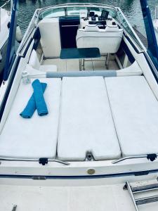 a boat with a pair of blue shoes on it at VINA ROMANCE - Romantic Boat Stay in Lisbon Marina in Lisbon