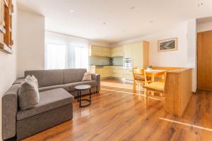 a living room with a couch and a table at Elisabeth Appartements in Damuls