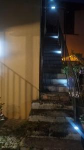 a set of stairs leading to a building at night at Appartamento Trezzo sull'Adda in Trezzo sullʼAdda