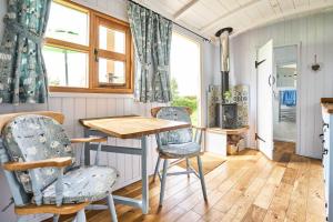 a kitchen with a table and chairs in a room at Host & Stay - Shepherds View in Alburgh +8 photos