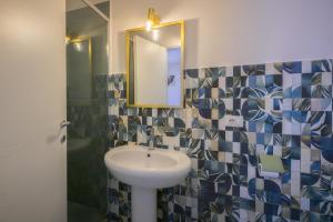 a bathroom with a sink and a mirror at La Colombaia Bed and Rooms in Belvedere Marittimo +15 photos