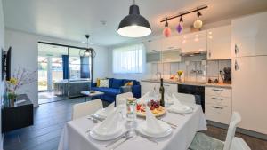 a kitchen and dining room with a table and chairs at Villa Una by Villas Guide in Gornji Kneginec