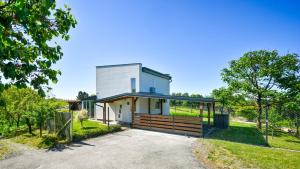 a house with a pivot door in a yard at Villa Una by Villas Guide in Gornji Kneginec