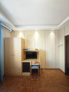 a small room with a desk and cabinets at Hotel Ristorante Oro in Cento +22 photos