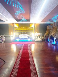 a dance floor with a red carpet in a room at Hotel Ristorante Oro in Cento