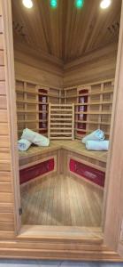 a large wooden room with two beds in it at Le gîte d’Hayen in Sprimont