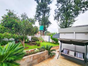 a view of a backyard with a house at Falcon Guest House in Harare