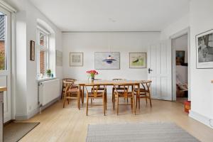 a dining room with a table and chairs at Cozy Holiday Home In Marstal On Ærø in Marstal
