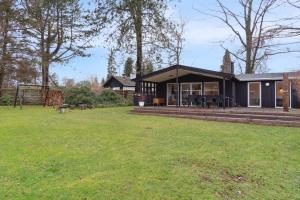 a house with a large yard in front of it at Relaxing Sanctuary In Desirable Area in Hornbæk