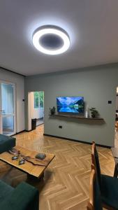 a living room with a couch and a table at Avliga Designer Residence in Varna City