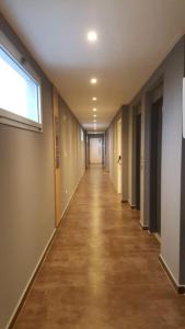 an empty hallway in an office building with a window at Shackleton in Wilde
