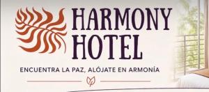 a sign for the honorary hotel in a room at HotelHarmonyHN in Peña Blanca