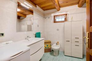 a bathroom with a sink and a toilet at Casa Piertor Morgex in Morgex +37 photos