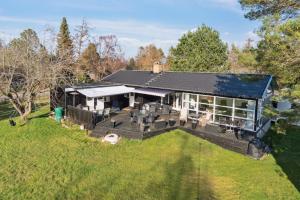 an aerial view of a house with a large yard at Cozy Cottage Only 500 M From The Sea in Gilleleje +32 photos