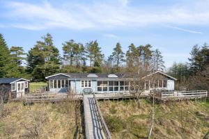 a house in the middle of a field at Pool House With Space For Relaxation in Bording Stationsby