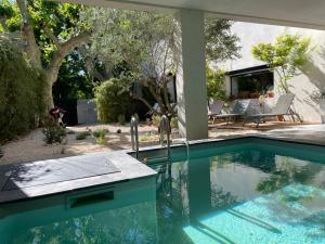 a swimming pool in the backyard of a house at Le Valat in Saze