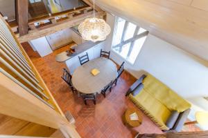 an overhead view of a dining room table and chairs at Le clos des berdins in Saint-Jean-de-Bonneval