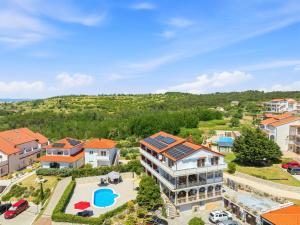 an aerial view of a house with a swimming pool at Guesthouse Marija II in Lopar