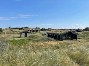 a house in the middle of a field at 70S Charm Just 300 M From The Beach in Blokhus