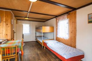 a room with two beds and a bunk bed at Autokemp Křivonoska in České Budějovice +26 photos