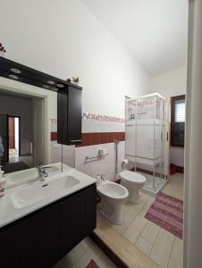 a bathroom with a sink and a toilet at IL CENTRO SUI 1000 in Marsala +71 photos