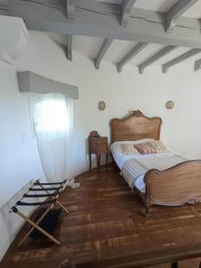 a bedroom with a bed and a window at La Tour in Béziers +22 photos