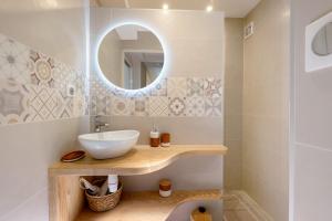 a bathroom with a sink and a mirror at Maison "Casabert" in Saint-Martin-de-la-Porte +15 photos