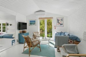 a living room with a couch and a table at Cozy Holiday Home in Nyrup