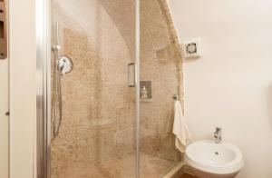 a bathroom with a shower with a toilet and a sink at Nel cuore di Narni - ItalyWeGo in Narni