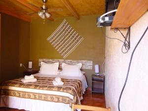 Ένα ή περισσότερα κρεβάτια σε δωμάτιο στο Hostal Pablito