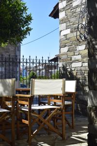 two chairs and a table on a patio at Villa Viviana in Milina
