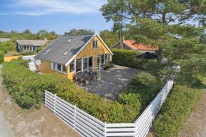 an aerial view of a house with a white fence at Panoramic View And Denmarks Best Beach in Neksø