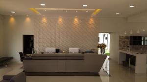 a lobby with a reception desk in a building at Hotel Mandino in Alta Floresta +79 photos