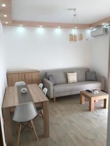a living room with a couch and a table at Apartments Suljovic in Ulcinj