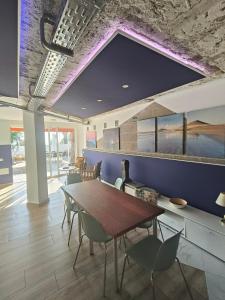 a dining room with a table and chairs at "The Sisters' Hostel" the women only hostel in Adeje
