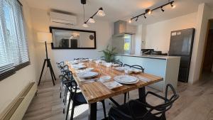 a long wooden table with chairs in a room at Ts House Hakodate Park Front in Hakodate +29 photos