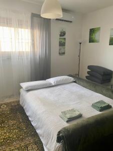 a bedroom with a bed with two towels on it at Respiro di Bosco in Robbiate
