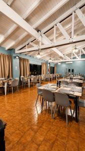 a large room with tables and chairs in it at Essencial Hotel Spa in Mendoza +64 photos