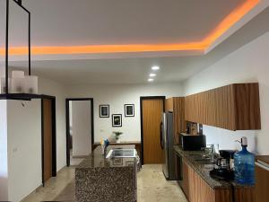 a kitchen with granite counter tops in a room at Condo Solana Oceanview and Jungle Bliss! in Sayulita +14 photos