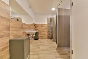 a bathroom with a sink and a toilet at Hostel u Arény in Ostrava +58 photos