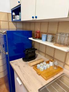 a kitchen with a wooden cutting board on a counter at Rome Home Cinecittà in Rome