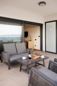 a living room with a couch and a table at Stella Maris Deluxe in Podstrana