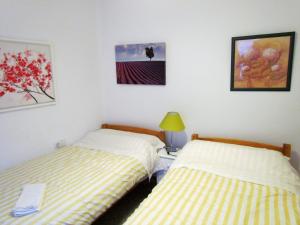 Łóżko lub łóżka w pokoju w obiekcie Casacelin