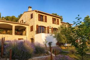 a stone house with a garden in front of it at Villa Lavendel in Montauroux +28 photos