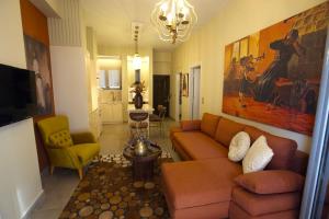 a living room with a couch and two chairs at Chrysiida Luxury Apt, Stroll to Nafplio Center in Nafplio +22 photos