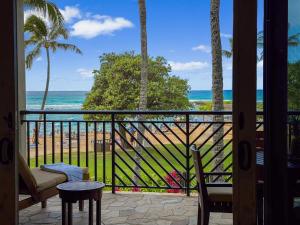 a balcony with a view of the beach at 3-Bed Villa 203 at Turtle Bay in Kahuku