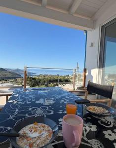 a table with two plates of food on top of a table at Sciara Eolie in Lipari