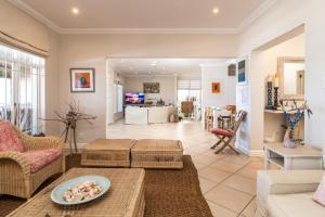 a living room with a couch and a table at Colwyn Drive 53 in Sheffield Beach