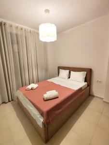a bedroom with a bed with two towels on it at Luxury Suite Gala in Nikiti +31 photos